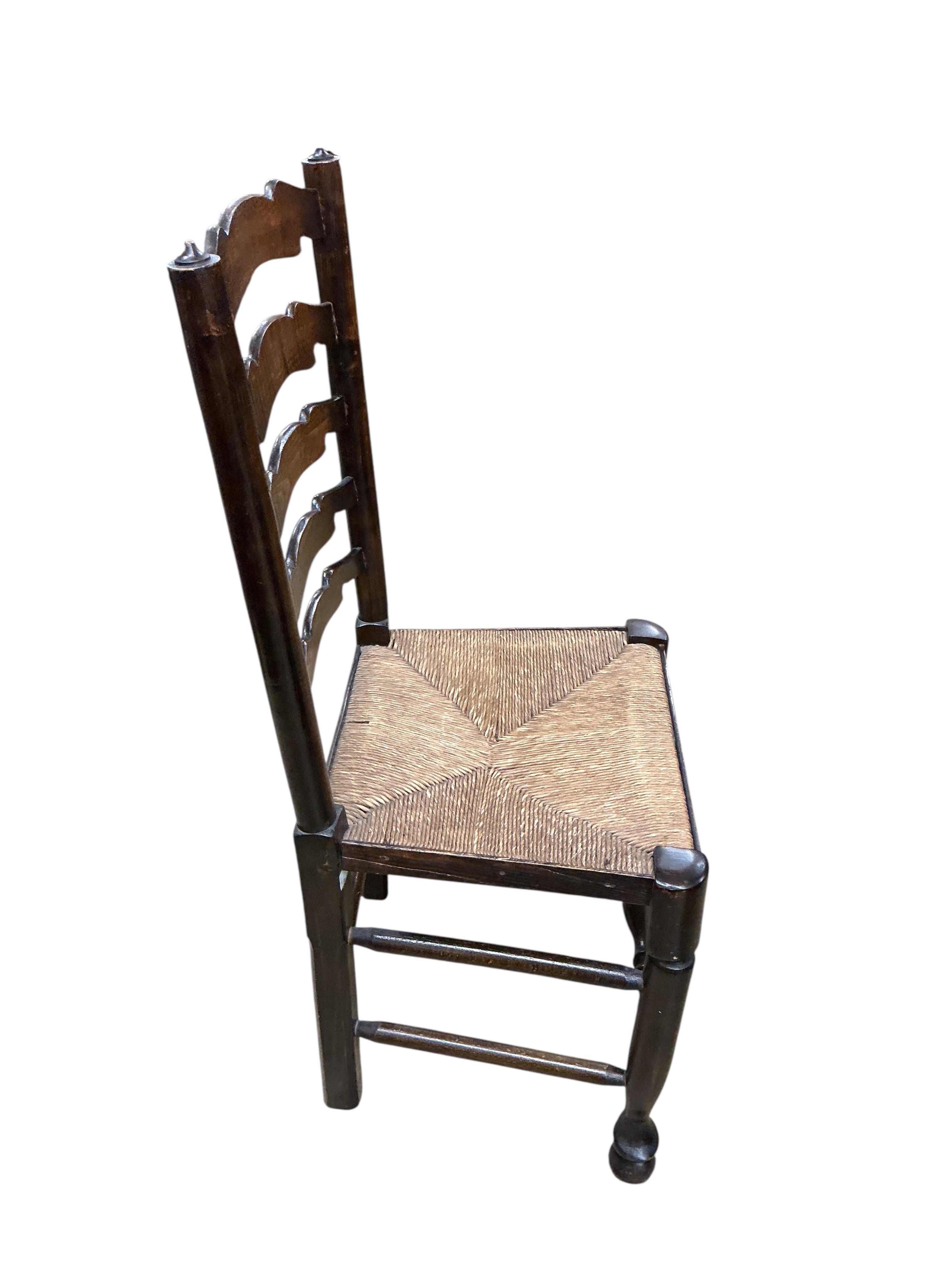 A set of six Lancashire style elm and beech rush seat ladder back dining chairs, width 41cm, height 100cm